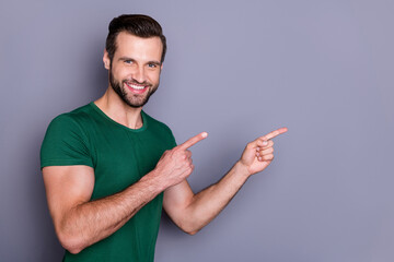 Poster - Portrait of positive guy promoter point index finger copyspace indicate discount adverts promo suggest select wear good look outfit isolated over gray color background