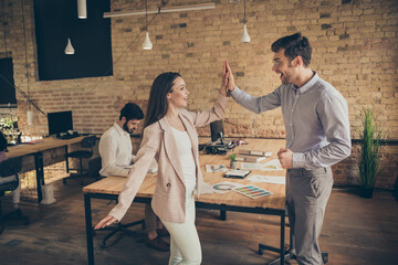 Wall Mural - Yeah we did it. Photo of ecstatic woman man marketer achieve aim innovation anti crisis strategy plan progress deal investors partners hold hand hi-fi in modern workplace