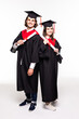 © F8  \ Suport Ukraine - Full length portrait of a young couple posing with their diplomas isolated on white background