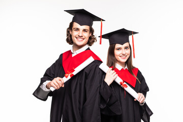 Poster - Full length portrait of a young couple posing with their diplomas isolated on white background