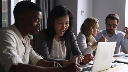 Canvas Print - Friendly middle aged female asian manager mentor teach help happy male african intern new employee training explain computer work on laptop instructing trainee in office apprentice internship course