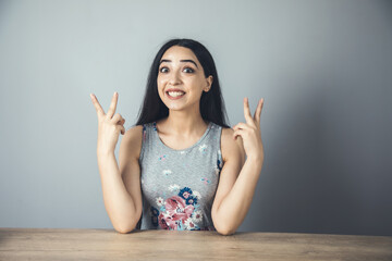 Wall Mural - happy woman hand victory sign