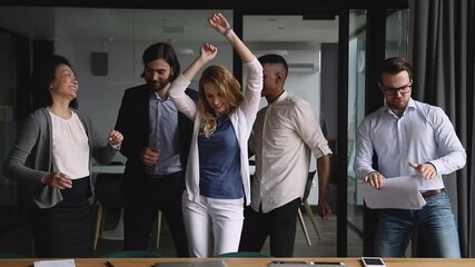 Wall Mural - Funny happy diverse business team people dancing together at corporate office party, friendly multiethnic colleagues group having fun celebrate friday enjoying success in victory dance concept