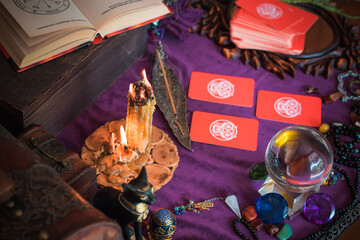  Tarot cards, Concept of fortune telling and predictions, magical rituals and wicca elements on a table