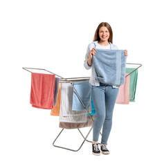 Canvas Print - Woman with clean towels and clothes dryer on white background