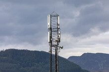 Telecom Mast With Hills In The Background