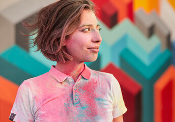 Wall Mural - Young woman with paint on t shirt looking away
