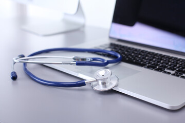 Wall Mural - Medical equipment: blue stethoscope and tablet on white background. Medical equipment