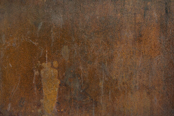 Old rusty metal surface with black paint flaking and cracking texture