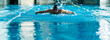 © Sondem - professional swimmer doing exercise in indoor swimming pool