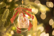 Original photograph of a nativity Christmas tree ornament hanging on a lighted Christmas tree 