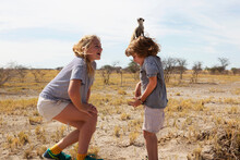 5 Year Old Boy With Meerkat On His Head, Kalahari Desert, Makgadikgadi Salt Pans, Botswana