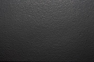 Canvas Print - Closeup shot of a black rough wall surface