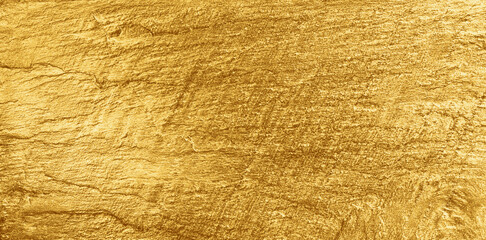 Sticker - Gold background. Golden shiny slate plate texture. Bright yellow reflective stone surface