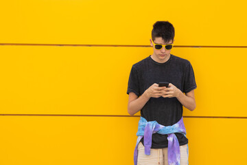 Poster - teenager on the city street with mobile phone