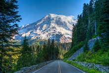 Mt Ranier And Park Road In Mt Ranier National Park, Washington. Glaciers And Snow Are Visible.