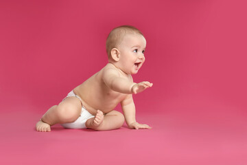 Poster - Cute little baby in diaper on pink background