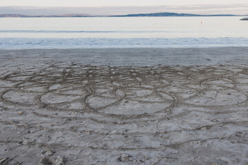 Wall Mural - beautiful pristine Tasmanian beach in South Hobart at dusk with circles drawned on the sand