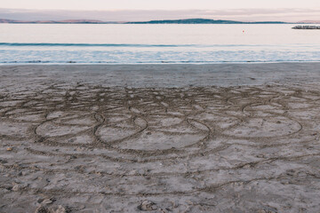 Wall Mural - beautiful pristine Tasmanian beach in South Hobart at dusk with circles drawned on the sand