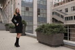 © UkrainianPhotgrapher - The girl in black coat. Beautiful emotional young girl in the city. Shawl or handkerchief on a person.