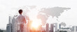 © adam121 - Concept of business success and control with confident boss against cityscape background