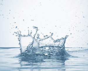  a scene in which drops of water splash after dropping an object in the water.