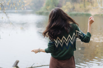 Wall Mural - young woman in the park, vacation near the lake