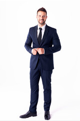 studio shot of handsome businessman wearing suit while standing at isolated white background