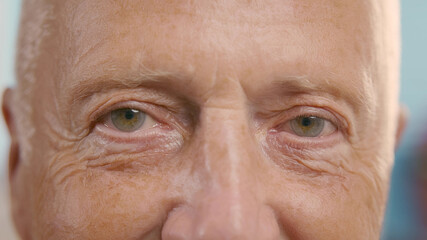 Cropped Shot Of Mature Man Eyes Smiling At Camera.