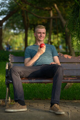 Wall Mural - Young man with blond hair at the park outdoors