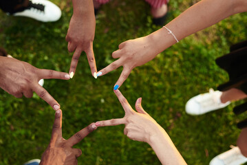 Black people with hands joined. People is making star with fingers.