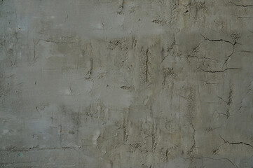 Wall Mural - The concrete wall is grey with cracks and irregularities on the surface .Texture or background