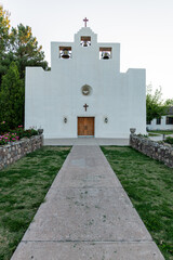 Walkway leading to the entrance doors of the St. Francis de Paula Franciscan Mission founded in 1865 in Tularosa, New Mexico.