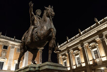 Bronze Horse Statue Of The Roman Emperor Marcus Aurelius Located In The Piazza Del Campidoglio Made By Michelangelo, Italy. The Photo Was Taken At Night On The Right Side Of The Capitoline Museums.