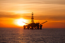 Offshore Oil Rig At Sunset Time