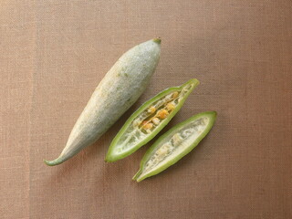 Wall Mural - Greenish white color raw whole Snake gourds or Trichosanthes cucumerina