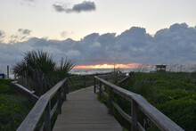 Walkway To The Sea And A View Of The Sunrise