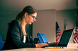 © Tasty Content  - Business girl in glasses with a laptop sitting in front of the window. Development of women's business