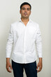 © Ranta Images - Portrait of handsome Indian businessman against white background