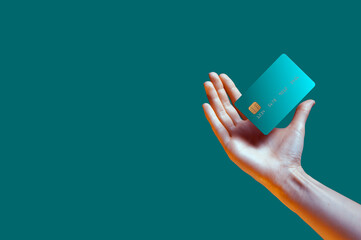 close up female hand holds levitating template mockup bank credit card with online service isolated 