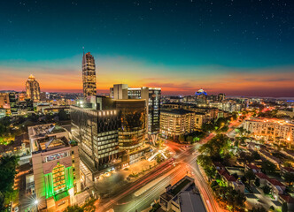 Wall Mural - Sandton city illuminated at night in Gauteng Johannesburg South Africa