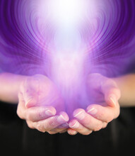 Demonstration Of Paranormal Activity - Cupped Hands With A Purple Entity Rising Up And Outwards And Space For Copy
