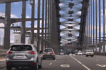 Driving across the Sydney Harbour Bridge heading south to the city