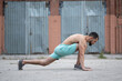 © Vladimir - Man does a warm-up before training on the street. Workout, training, lifestyle