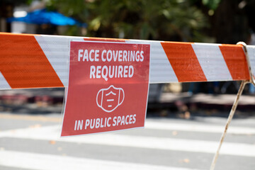 face covering required warning signs for face masks on public streets during covid 19 coronavirus