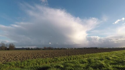 Sticker - Time lapse of a classic April shower over the wide open dutch countryside