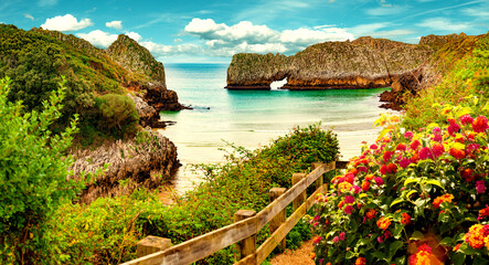 Wall Mural - Vivid landscape of beach and coast with mountains and vegetation.Stunning scenery of coastline, beach and cliffs in Cantabria, Spain