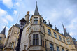 Photo with a fragment of a building with spires and a lantern