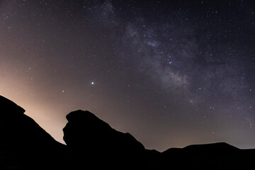Wall Mural - the milky way over the canyon in the desert