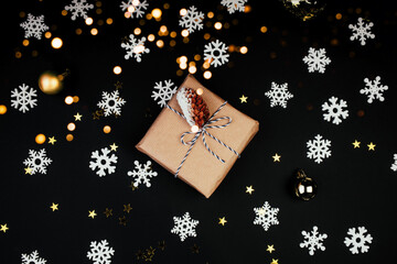 Wall Mural - new year's present on black color background snowflakes and glitters